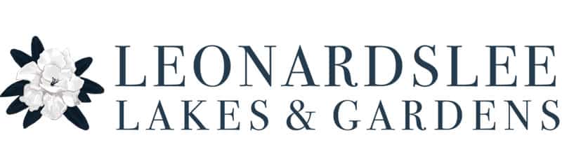 Leonardslee Lakes & Gardens logo with a white flower on the left.